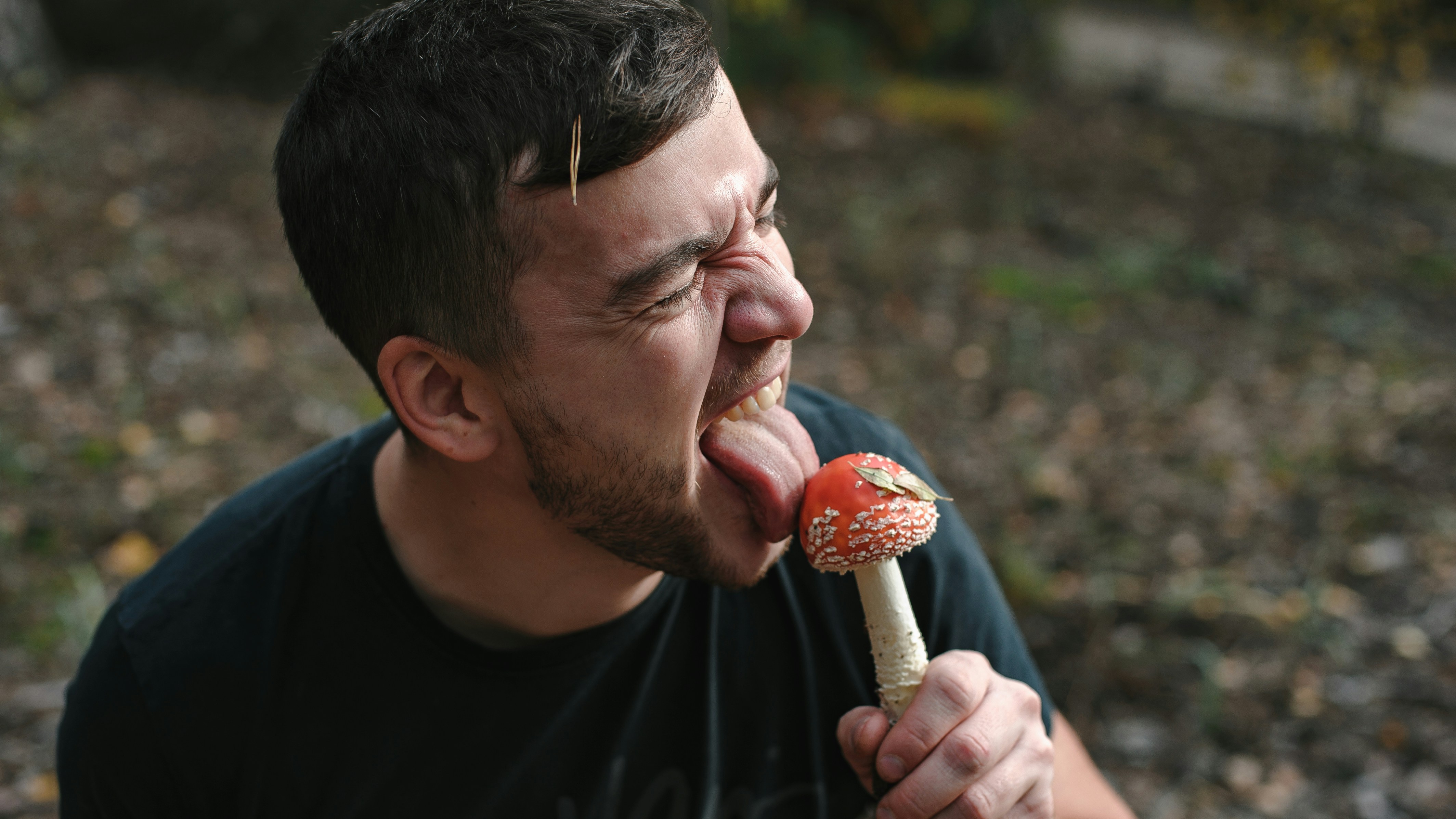 Man Tasing a Mushroom